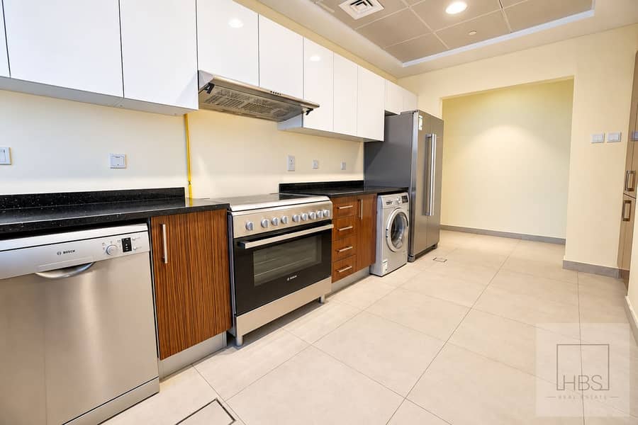 11 Modern Galley Kitchen with Stainless Appliances. png
