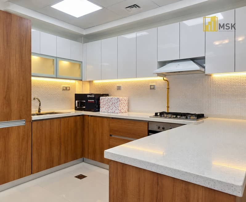 4 Mirrored Modern Kitchen with Warm Lighting. png