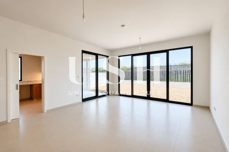 3 Sunlit Minimalist Room with Glass Doors. png