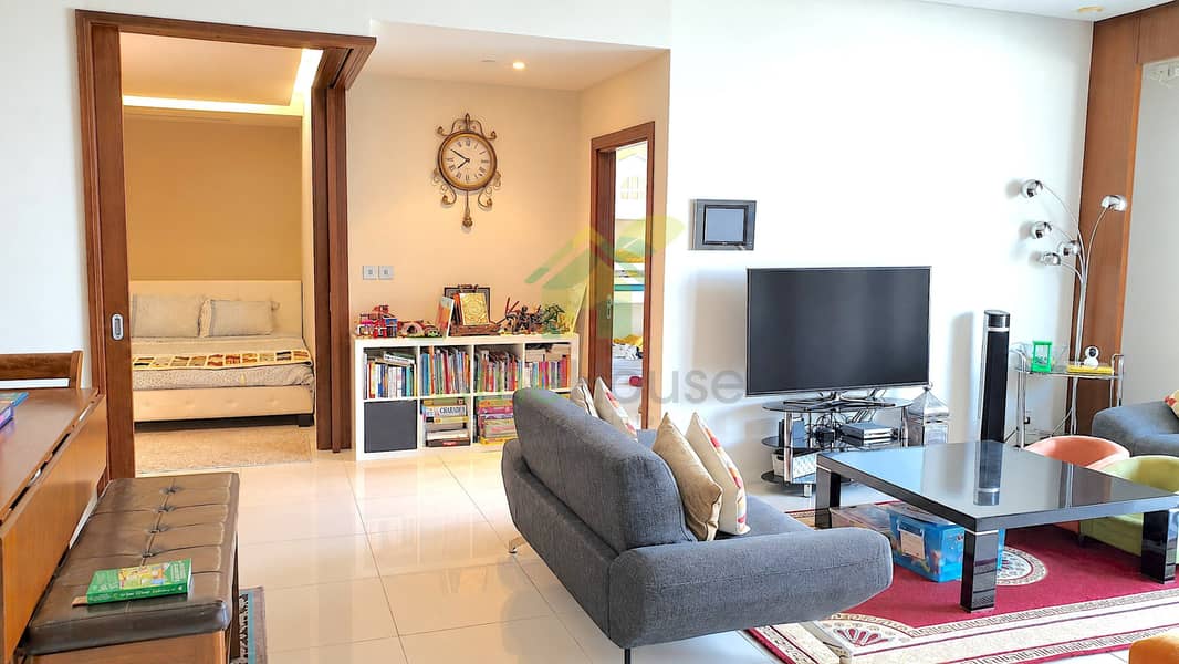 4 dubai-business-bay-ubora-tower-2-bedroom-apartment-living-room-tv-02. jpg