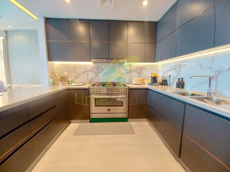 6 3-bedroom-apartment-5242-dubai-marina-kitchen-modern-cabinetry-marble-appliances. webp