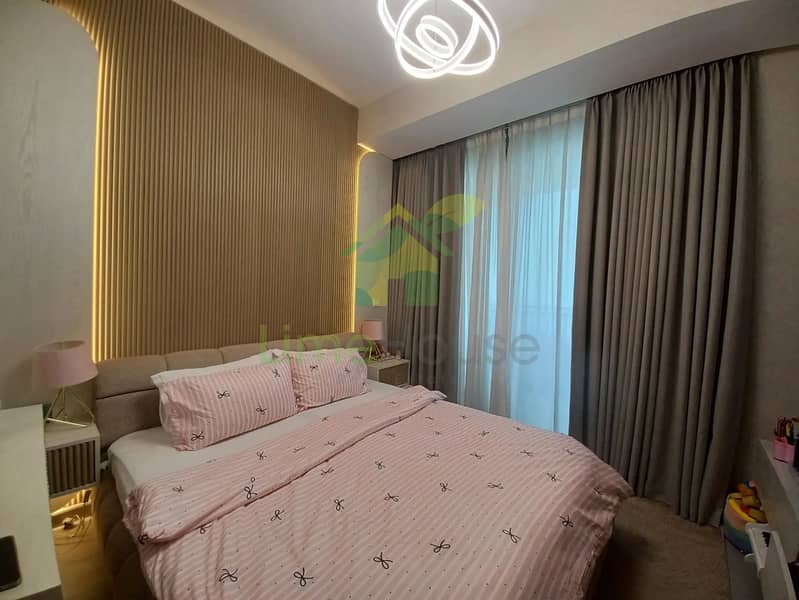 23 3-bedroom-apartment-5242-dubai-marina-bedroom-modern-light-wood-accent-wall. webp