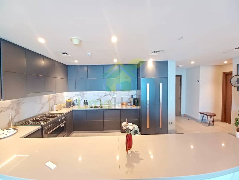 28 3-bedroom-apartment-5242-dubai-marina-kitchen-modern-marble-island. webp