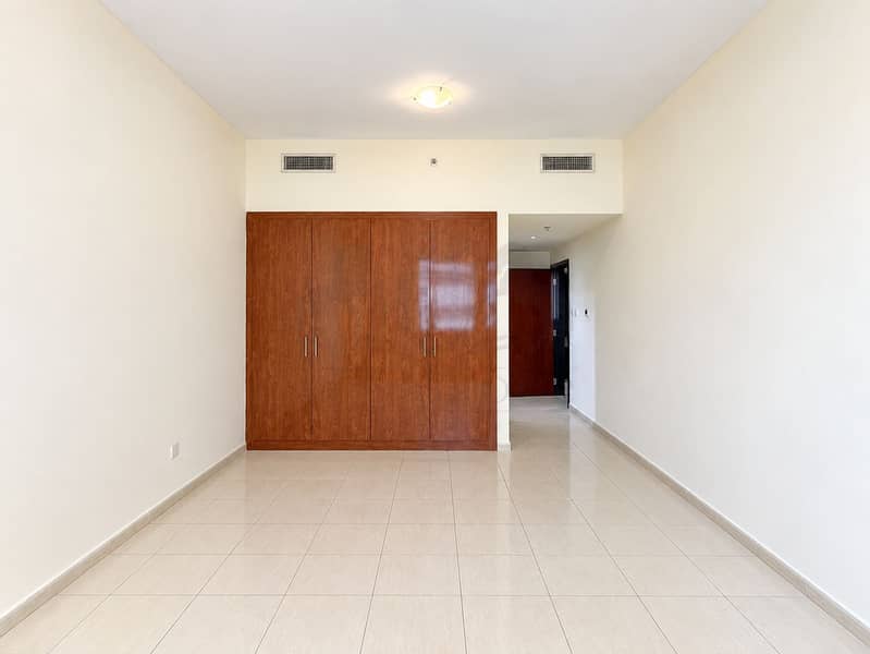6 Minimalist Room with Wooden Wardrobe and Hallway. png