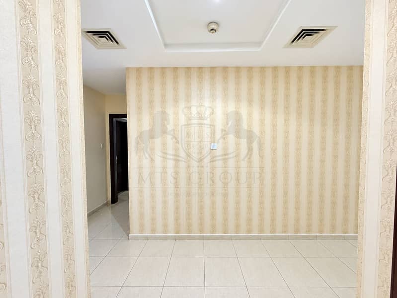 7 Bright Empty Hallway with Patterned Wallpaper. png