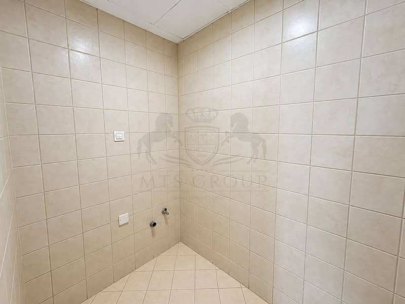 13 Empty Beige-Tiled Utility Room. png