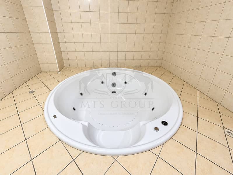 14 Bright Beige Tiled Whirlpool Bathroom. png