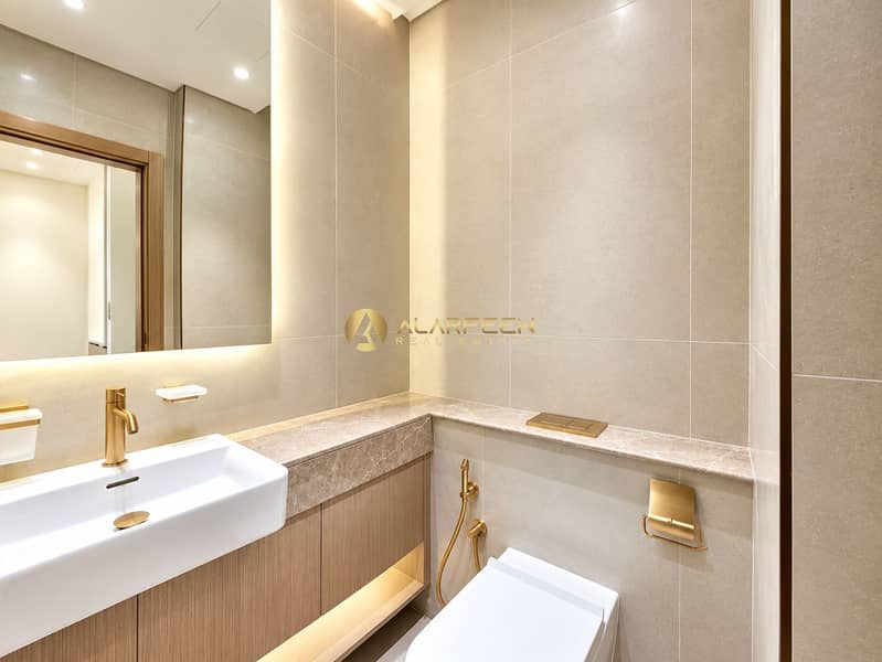 7 Luxurious Beige Bathroom with Brass Accents. jpeg