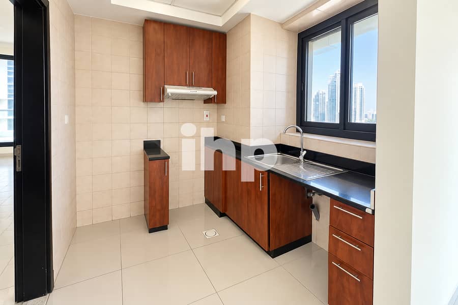 6 a_clean_modern_empty_compact_kitchen_interior_ph. jpg
