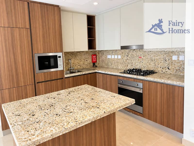2 Modern L-Shaped Kitchen with Granite Island. png