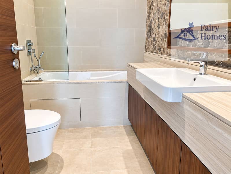 5 Modern Beige Bathroom with Hex Tile Accent. png