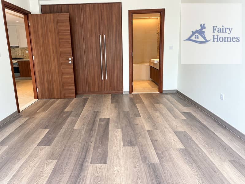 7 Modern Minimalist Room with Open Bath and Kitchen. png
