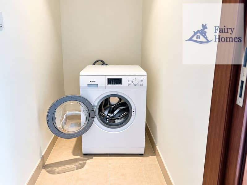 8 Open Smeg Washer in Minimalist Laundry Nook. png