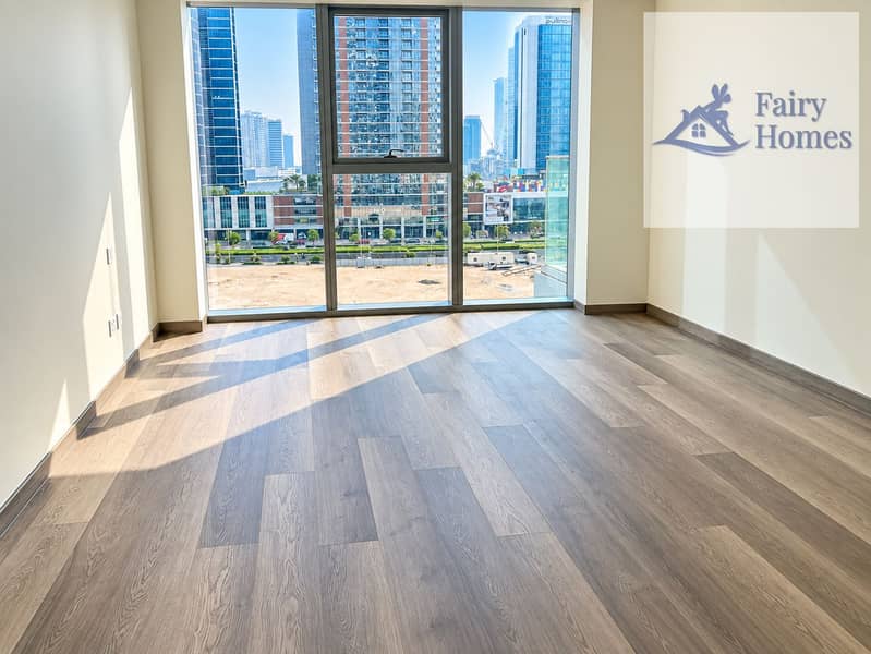 9 Sunlit Empty Room Overlooking City Towers. png