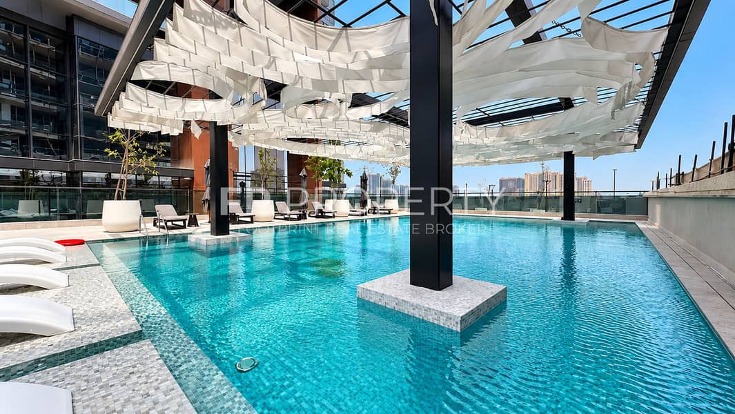 10 Luxury Rooftop Pool Under Sculptural Canopy. png