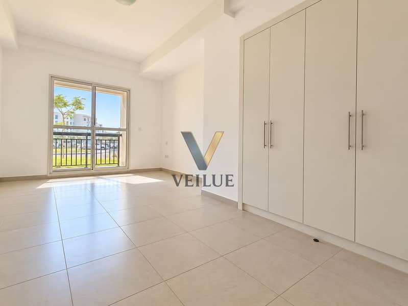 4 Sunlit Minimalist Bedroom with Balcony View. png