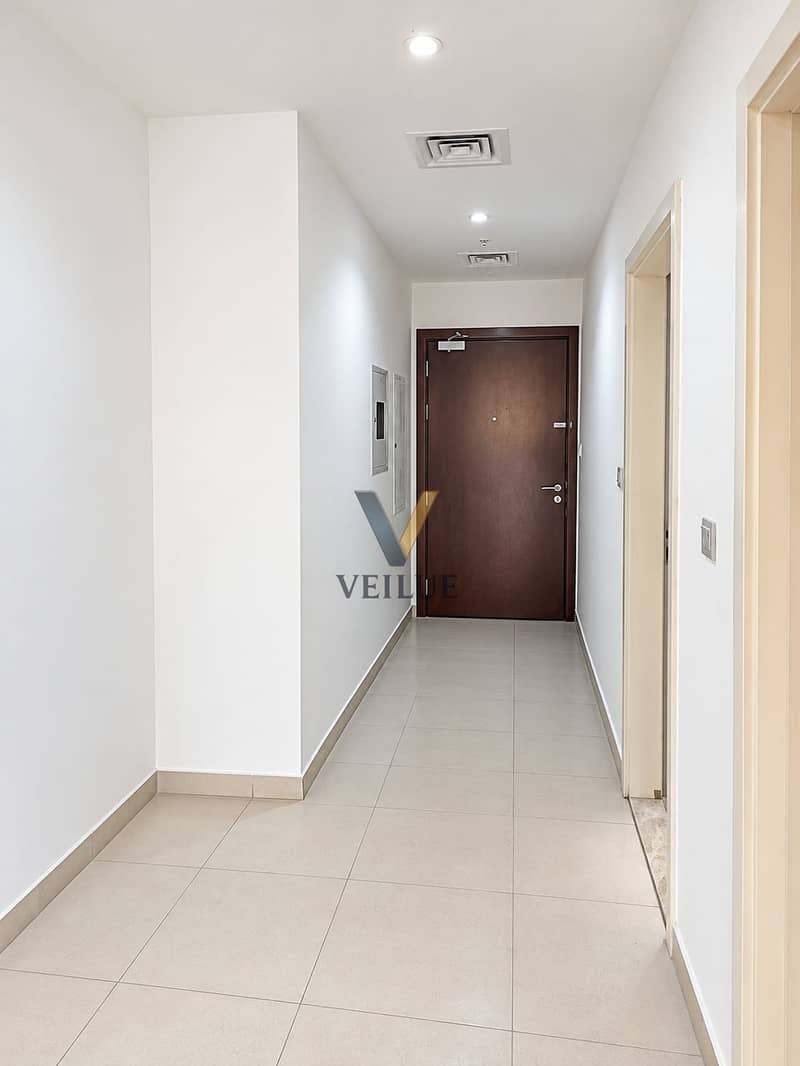 10 Minimalist Hallway to Dark Wooden Door. png