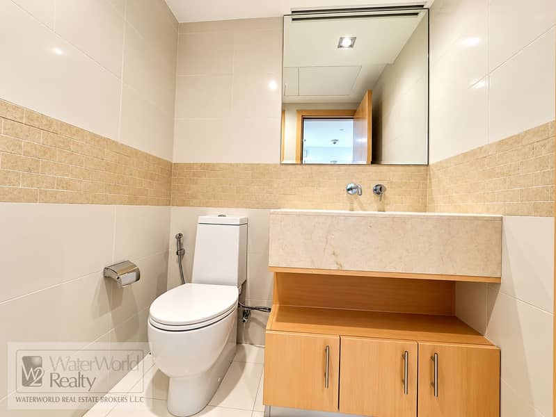 14 Modern Beige-Tiled Bathroom Interior. png