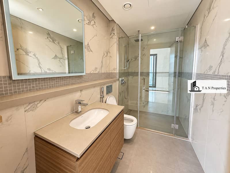 19 Modern Marble Bathroom with Glass Shower. png