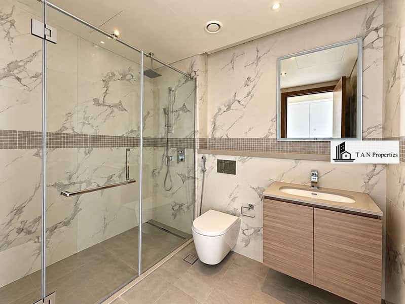 18 Modern Marble Bathroom with Glass Shower. png