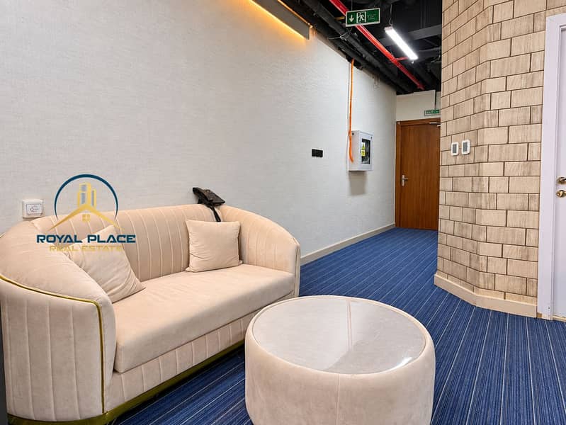11 Polished office lounge with curved stone wall. png