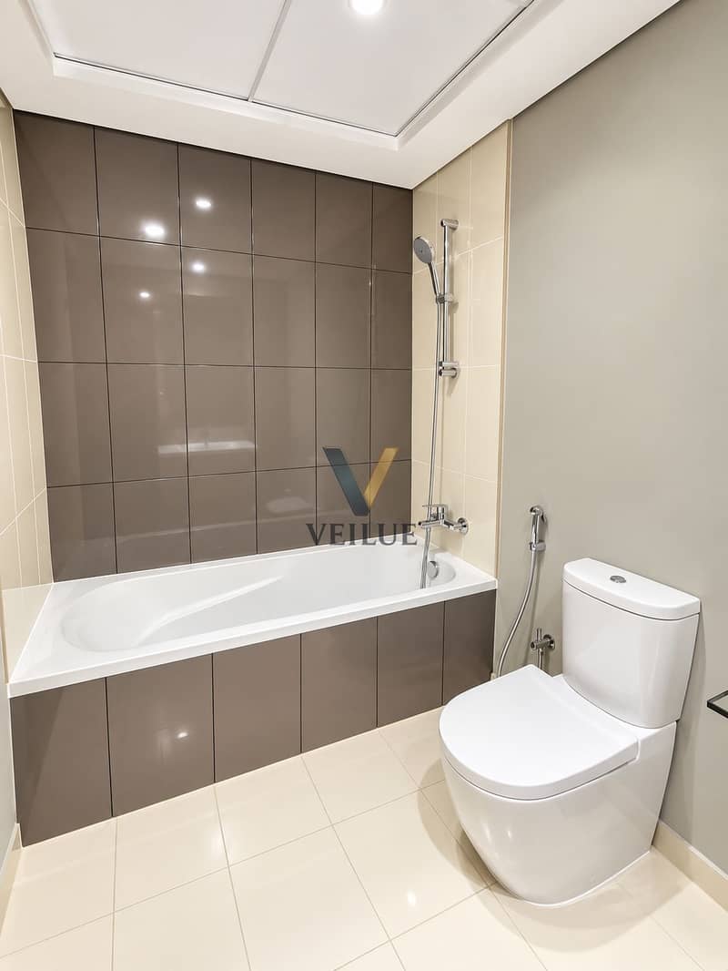 6 Modern Taupe-Tiled Bathroom. png