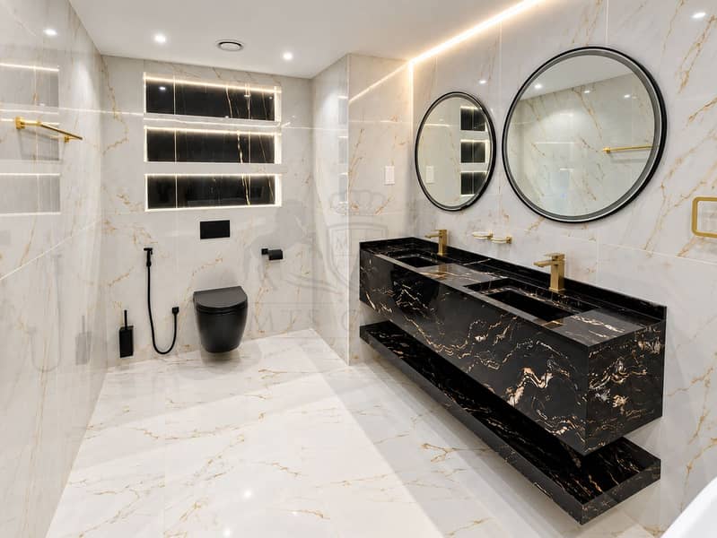 15 Luxury Marble Bathroom with Gold Accents. png