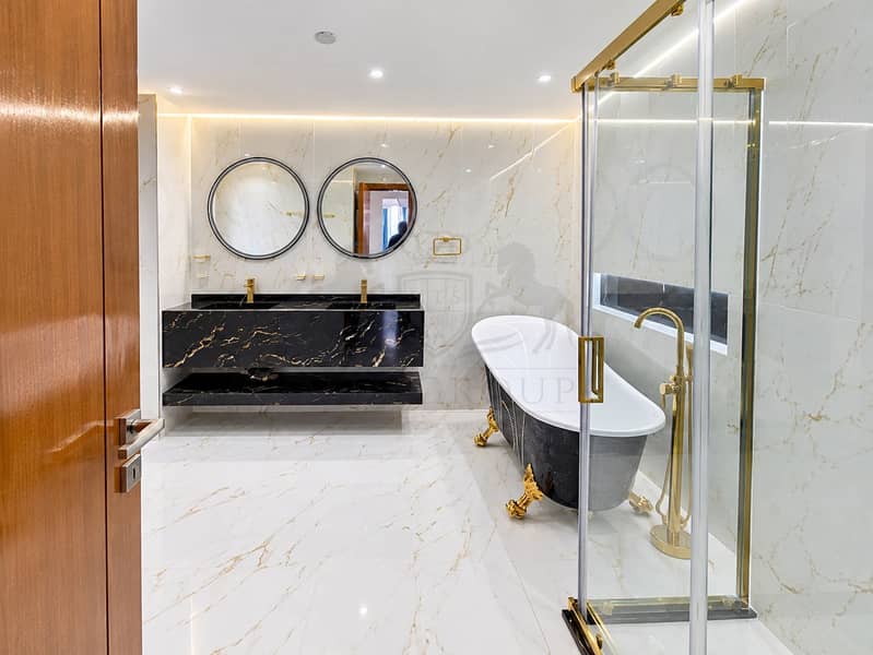 17 Modern Black-and-Gold Marble Bathroom. png