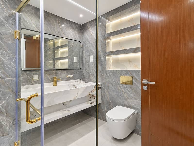 18 Modern Marble Bathroom with Gold Accents. png