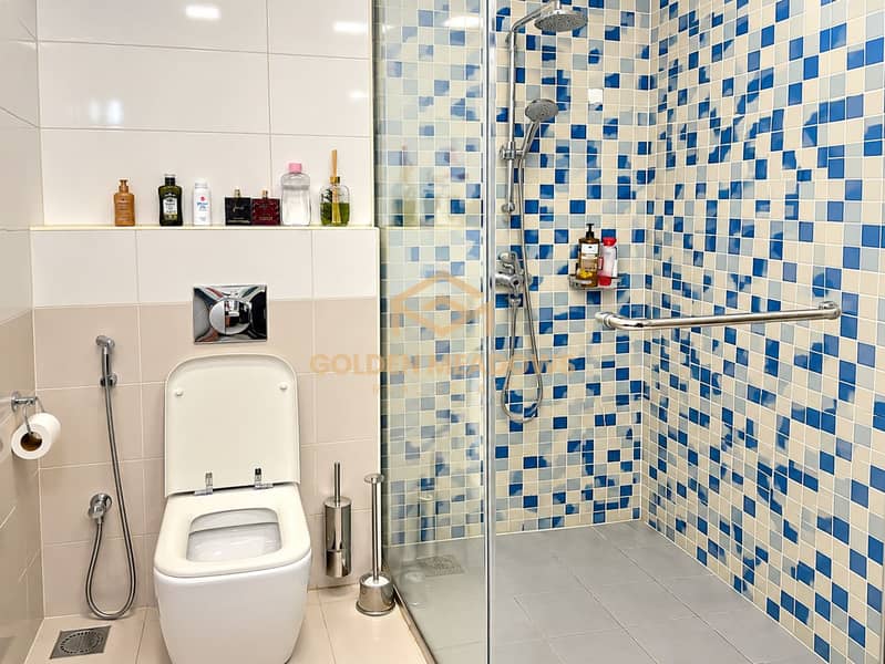 13 Modern Bathroom with Blue Mosaic Shower. png