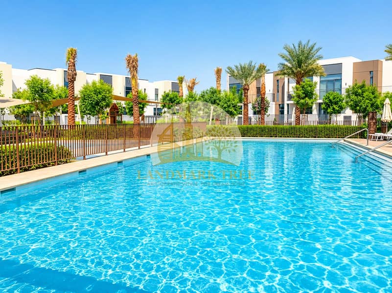 Luxury Resort Pool with Palm-Lined Villas. png Luxury Resort Pool with Palm-Lined Villas. png