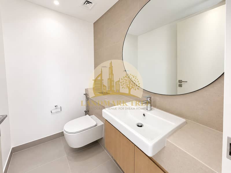 11 Minimalist Beige-Tiled Bathroom. png