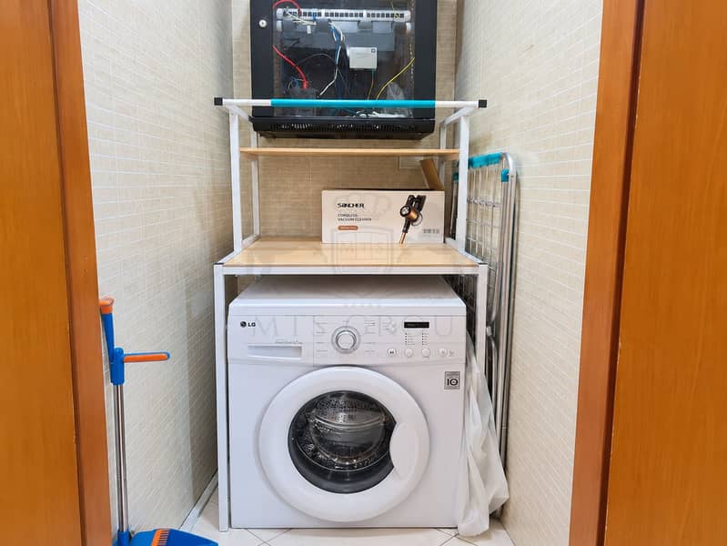 9 Tidy Utility Closet with Washer and Storage. png