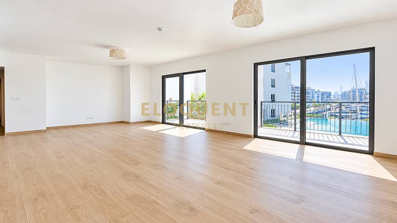 2 Bright Minimalist Living Room with Waterfront View. png