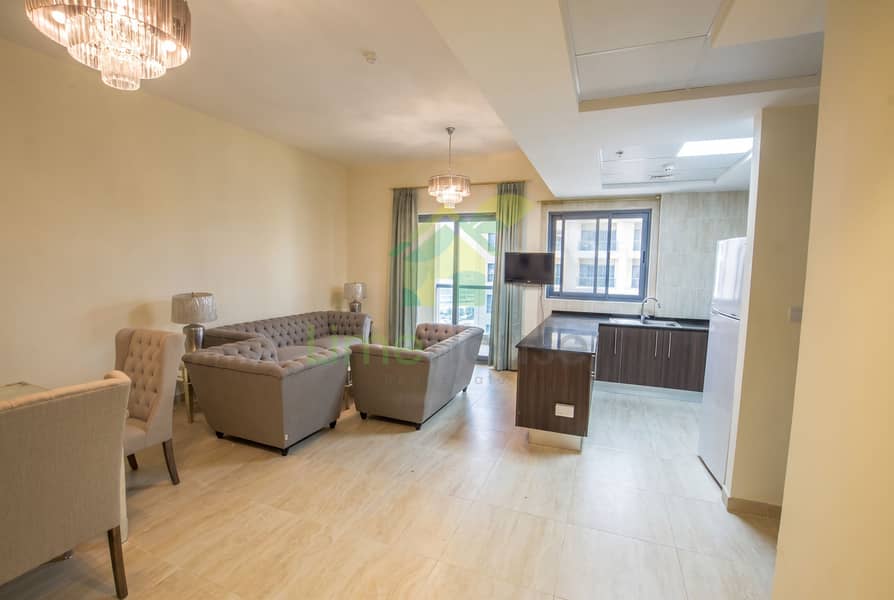 4 15-dubai-al-furjan-azizi-liatris-1-bedroom-apartment-open-plan-living-kitchen-balcony. jpg