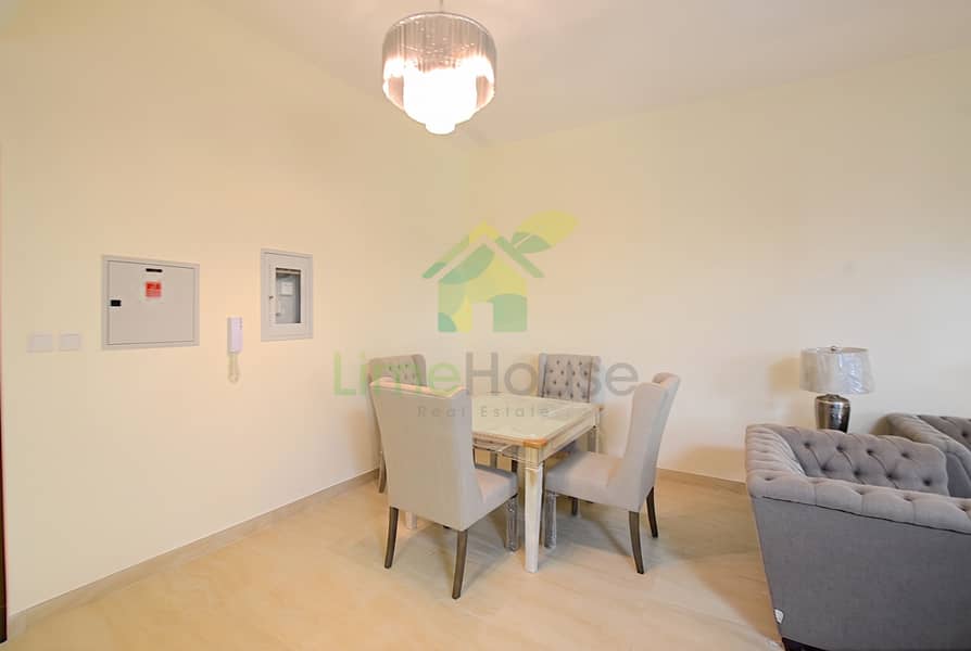 7 11-dubai-al-furjan-azizi-liatris-1-bedroom-apartment-dining-area-mirrored-table. jpg