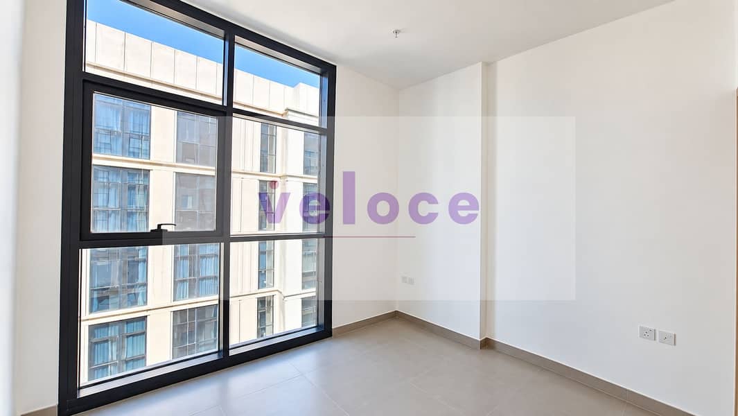 3 Bright Minimalist Room with City Window. png