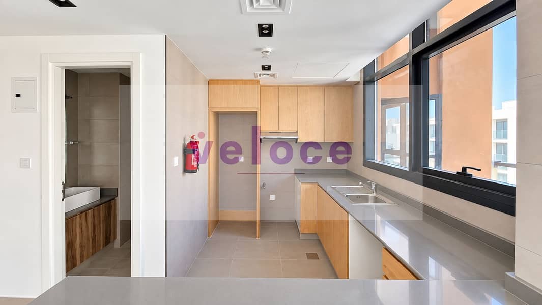 10 Bright Minimalist Kitchen with Balcony Views. png