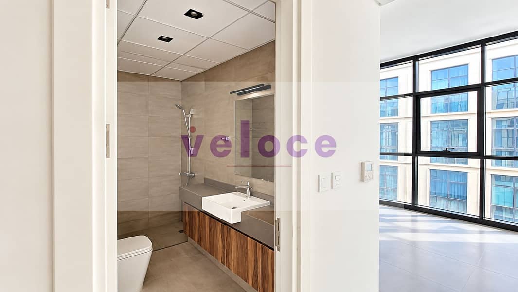 16 Modern Taupe-Tiled Bathroom Interior. png