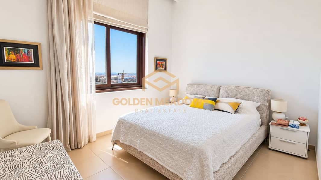 10 Sunlit Neutral Bedroom with City Views. png