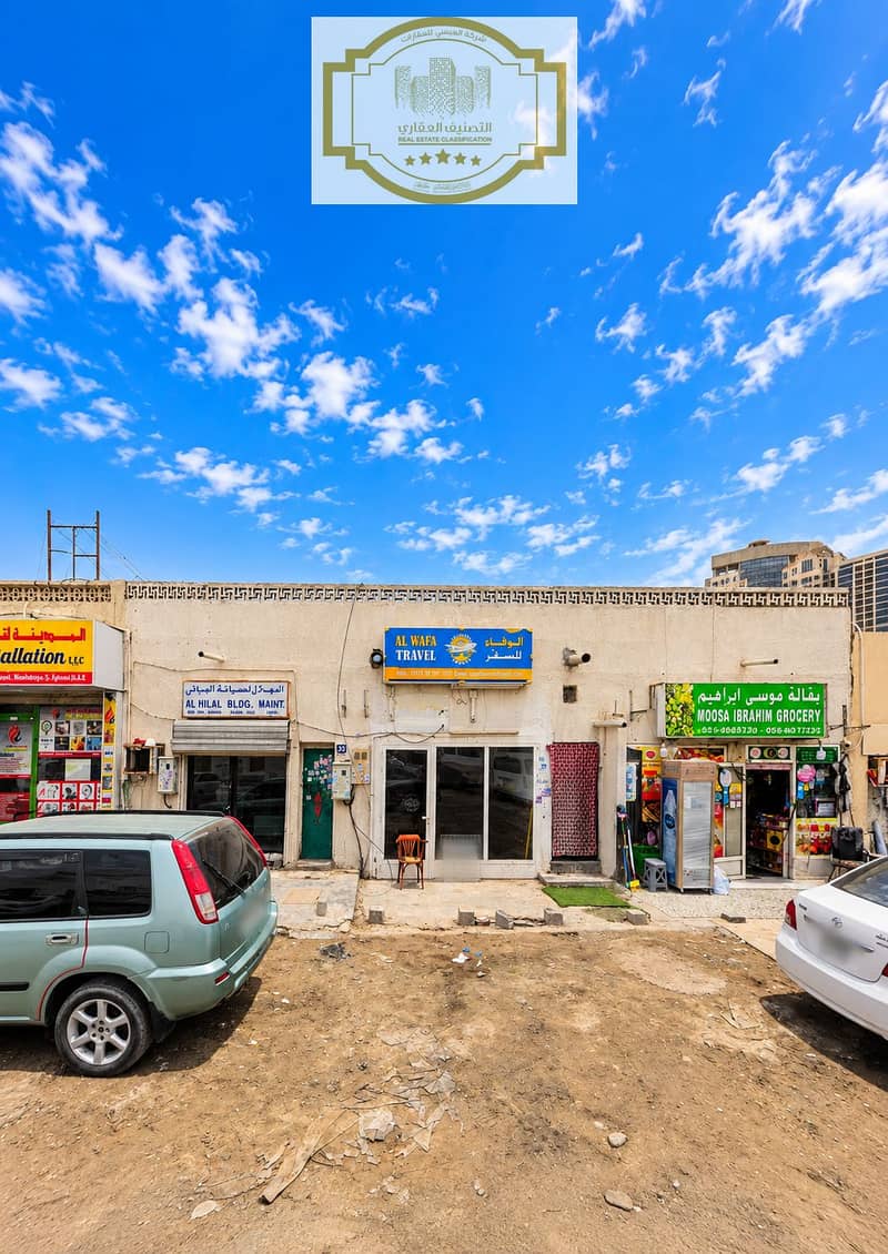 Al Wafa Travel Shopfront Under Blue Skies. png Al Wafa Travel Shopfront Under Blue Skies. png