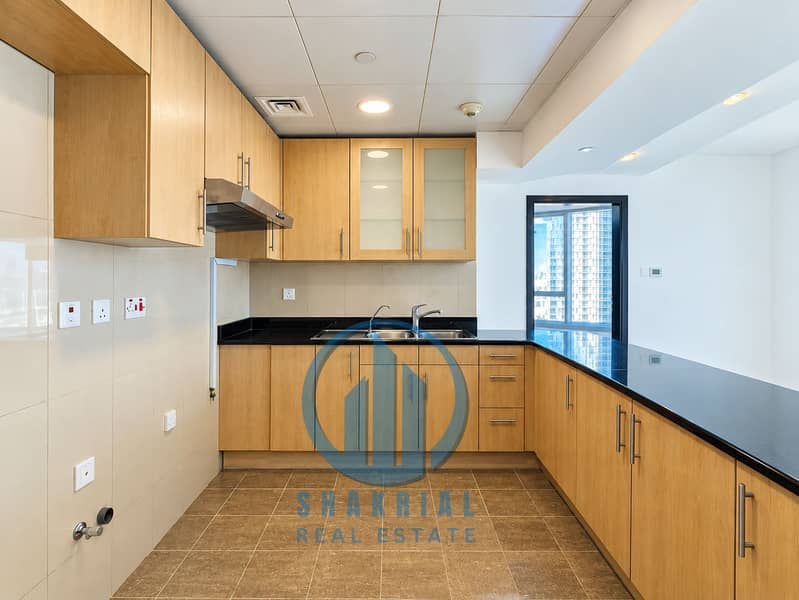 3 Modern Oak Kitchen with City Views. png