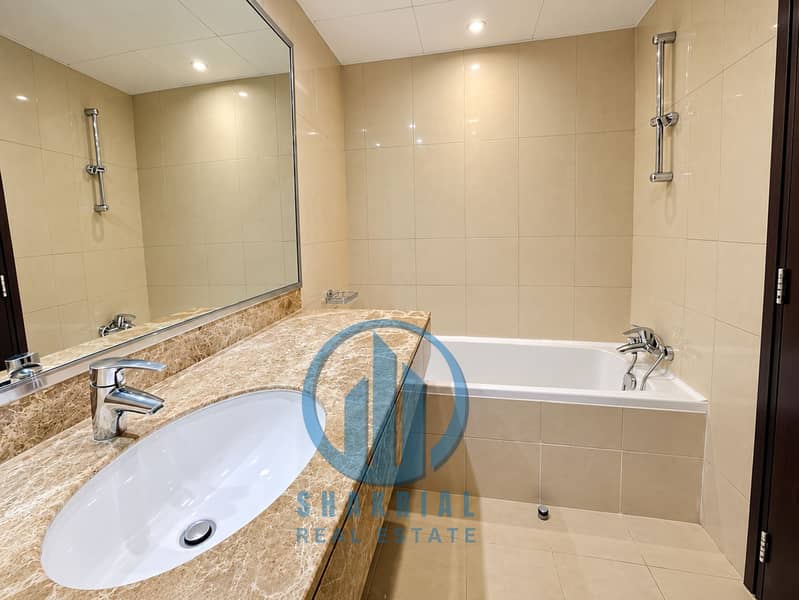 9 Modern Beige Marble Bathroom and Tub. png
