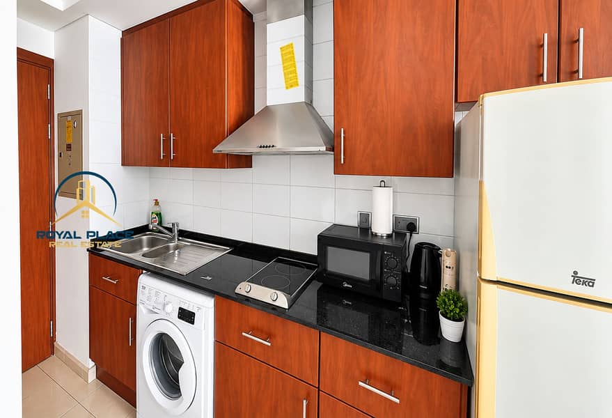 7 Compact Modern Kitchen with Stainless Appliances. png