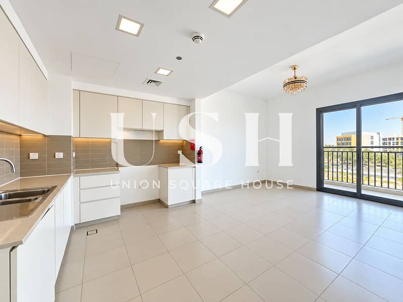 3 Bright Modern Kitchen with Balcony Views. png