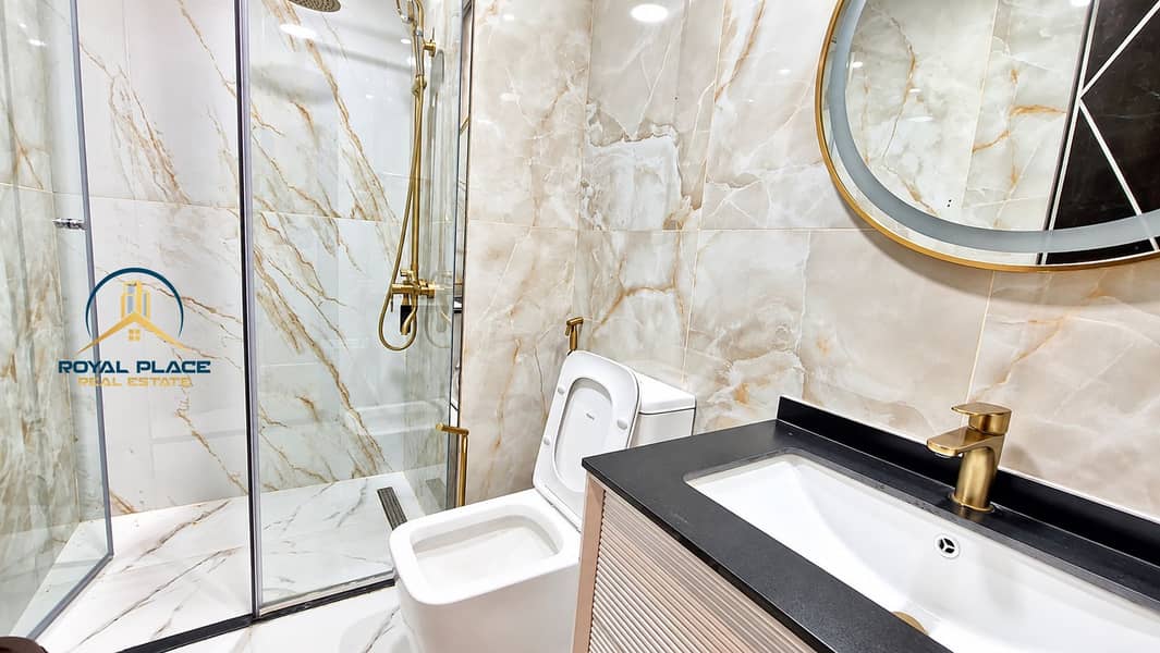 16 Modern Marble Bathroom with Brass Accents. png