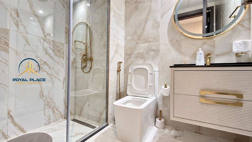 17 Luxurious Marble Bathroom with Brass Accents. png