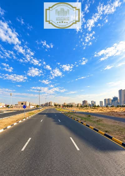 Plot de à à vendre à Al Alia, Ajman - Gulf City Road Beneath Blue Skies. png Plot de à à vendre à Al Alia, Ajman - Gulf City Road Beneath Blue Skies. png