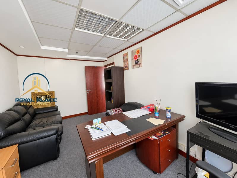 8 Bright furnished office with open doorway. png