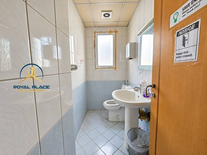 15 Naturally bright office washroom interior. png